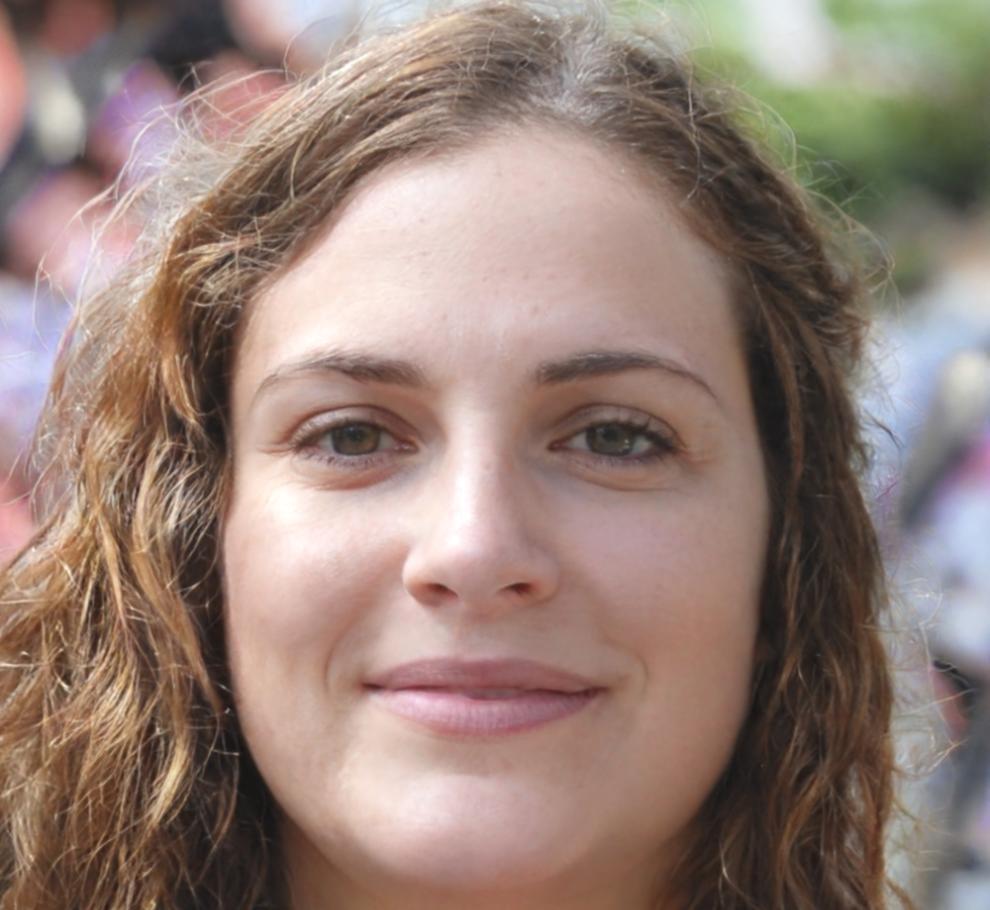 Instructor Fatma explaining game mechanics to students during workshop